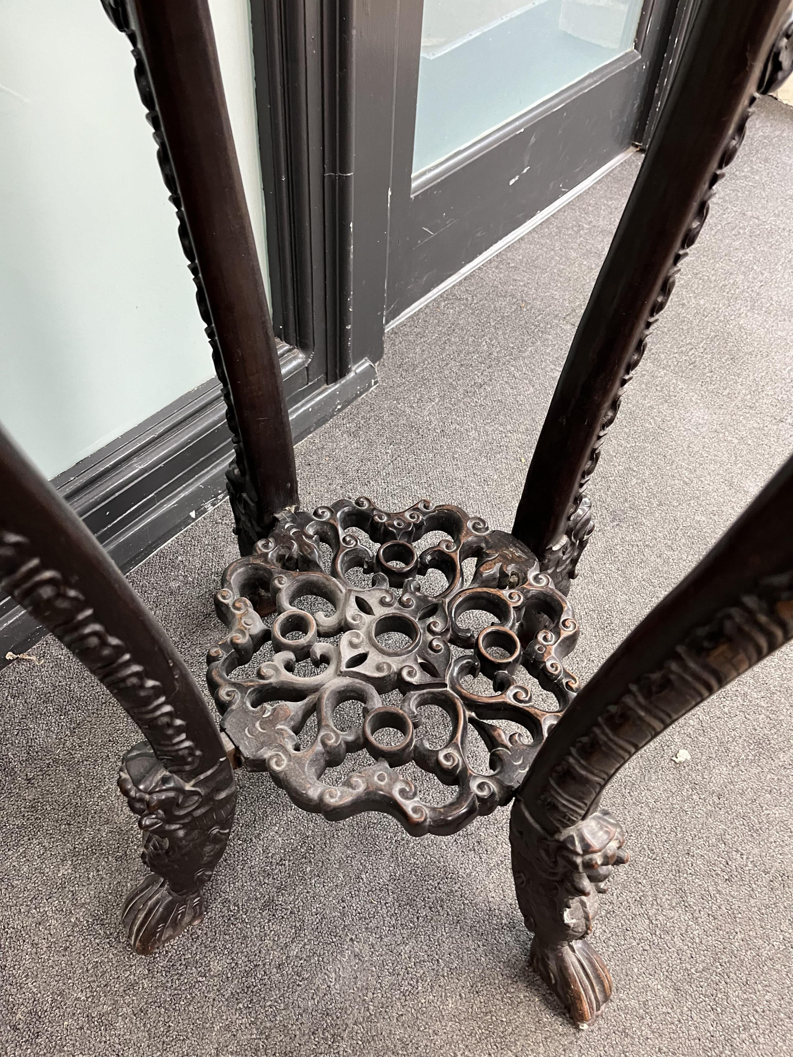 A Chinese carved hongmu rouge marble topped vase stand, diameter 42cm, height 93cm